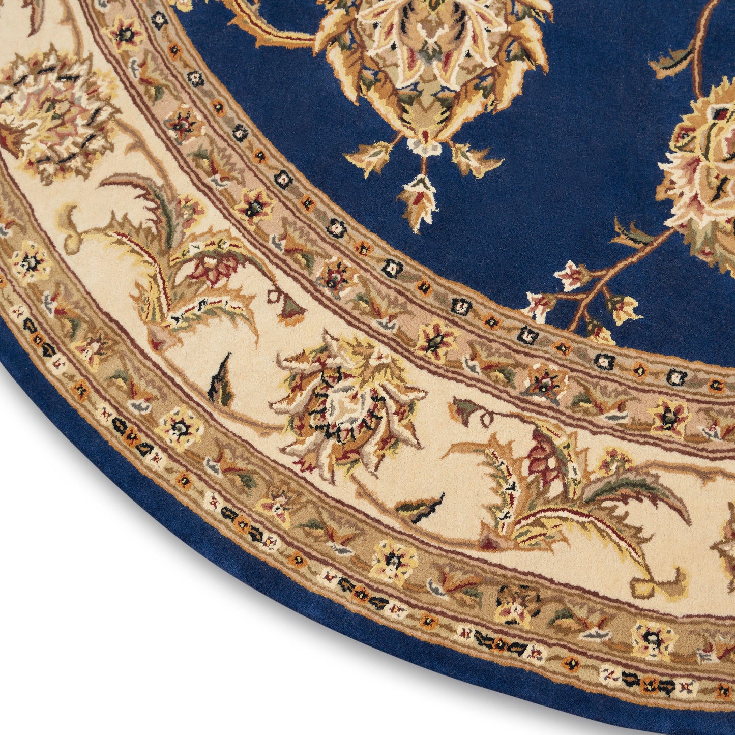 Round oriental area rug: navy blue center with cream/ivory floral border and intricate gold-toned vines.
