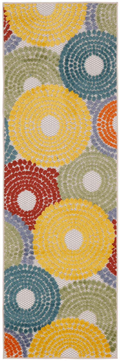 Rectangular rug runner with crochet-style texture and bold circular rosettes in yellow, teal, green, red, and orange.