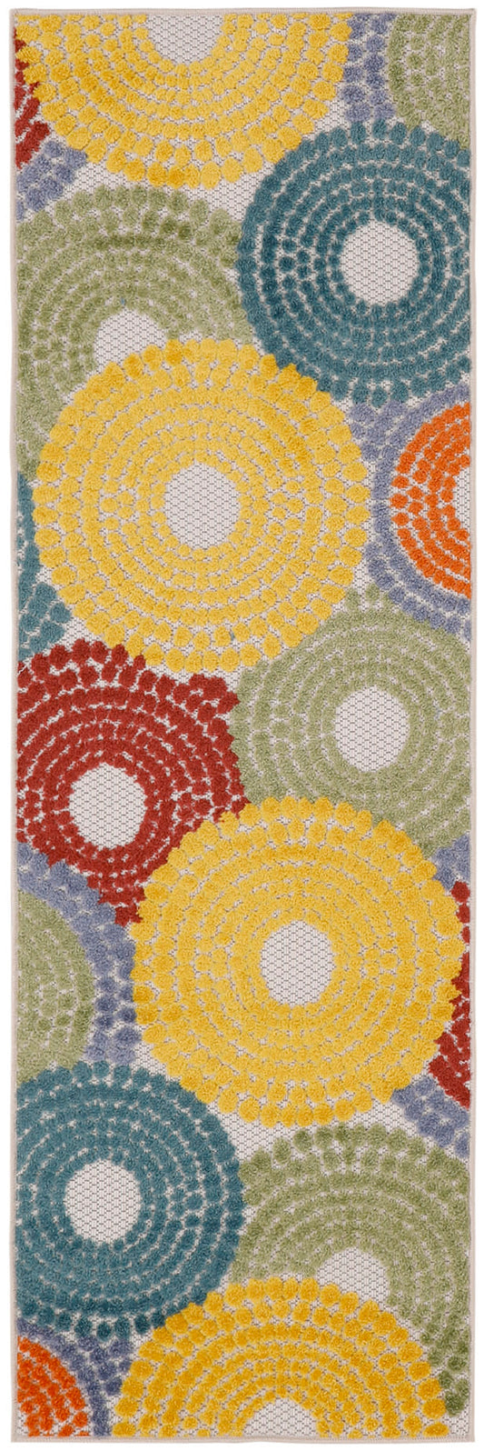 Rectangular rug runner with crochet-style texture and bold circular rosettes in yellow, teal, green, red, and orange.