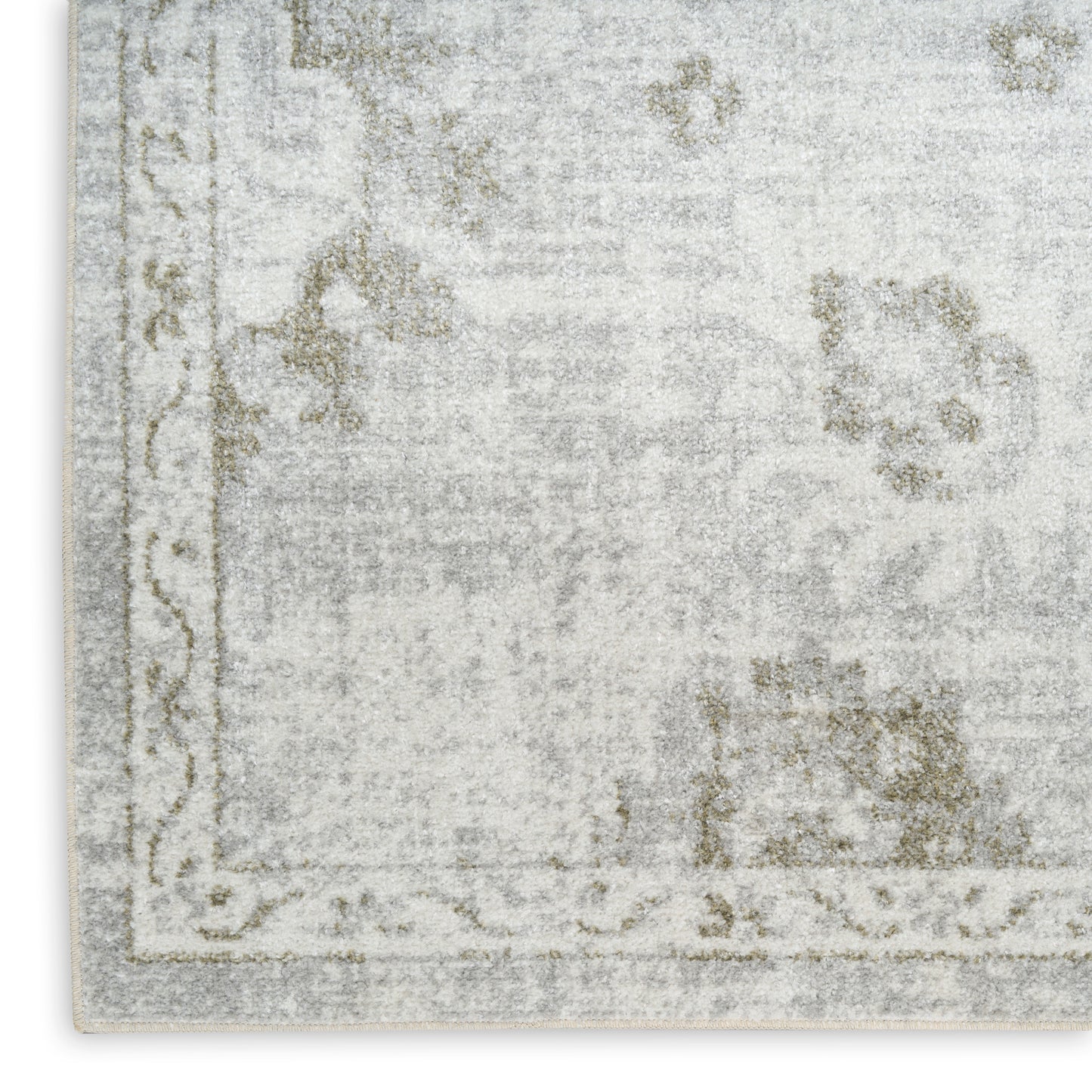 Rectangular rug in washed gray and ivory with faded floral motifs and decorative border.