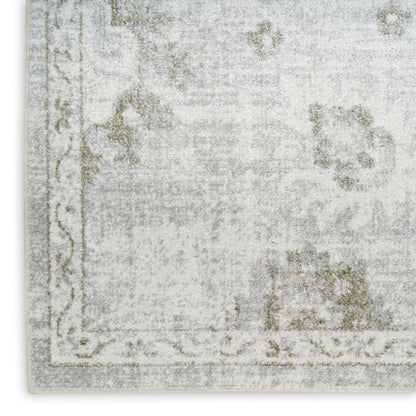 Rectangular rug in washed gray and ivory with faded floral motifs and decorative border.