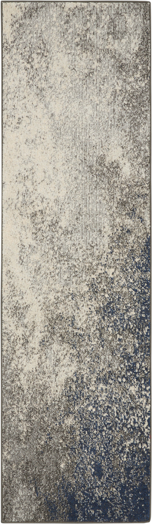 Long runner rug with beige-to-navy gradient & speckled, abstract texture for contemporary hall or living space.