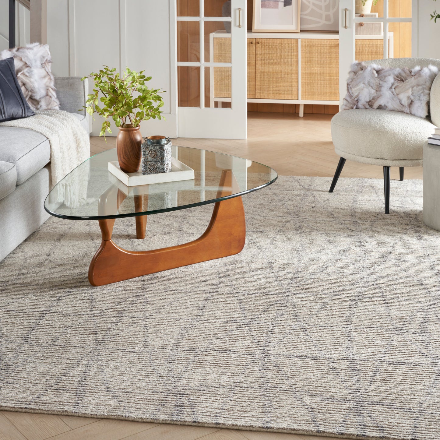 Neutral-toned Scandinavian-style rug with a textured weave, 8' x 10'.