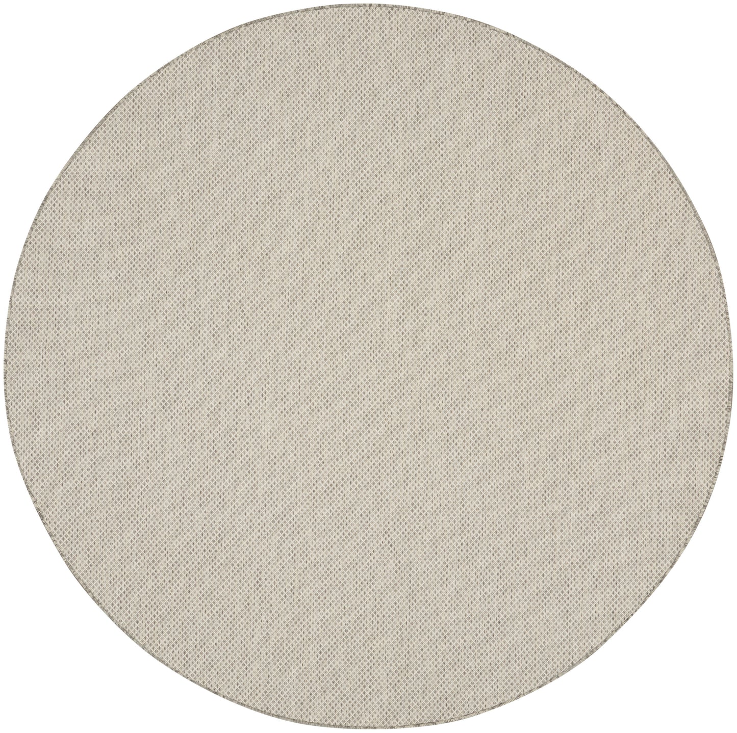 Beige circular fabric speaker grille with fine perforated texture.