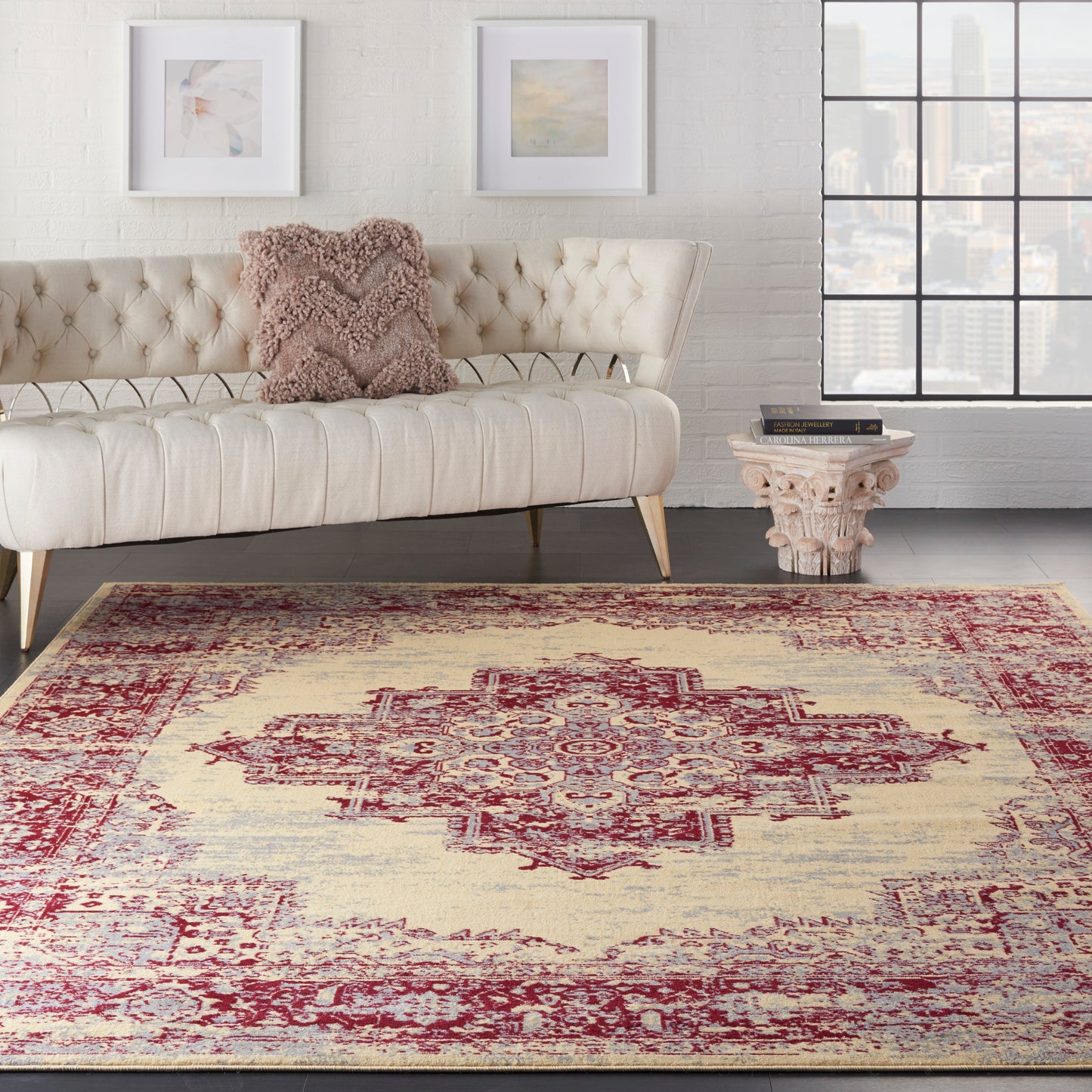 Vintage ivory rug with a red medallion, 7' x 10'.