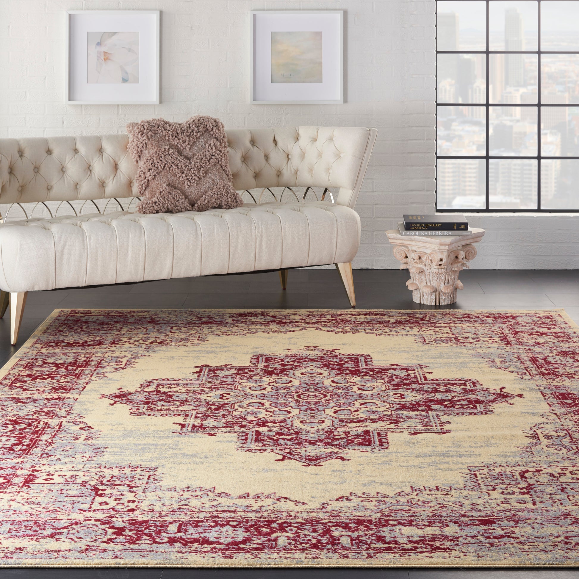 Vintage ivory rug with a red medallion, 7' x 10'.