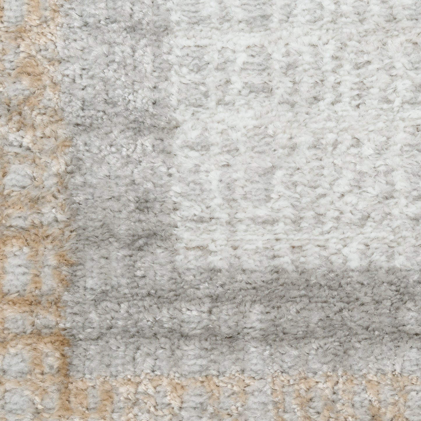 Soft shag rug in light gray, ivory & beige with subtle geometric border for modern living room decor.
