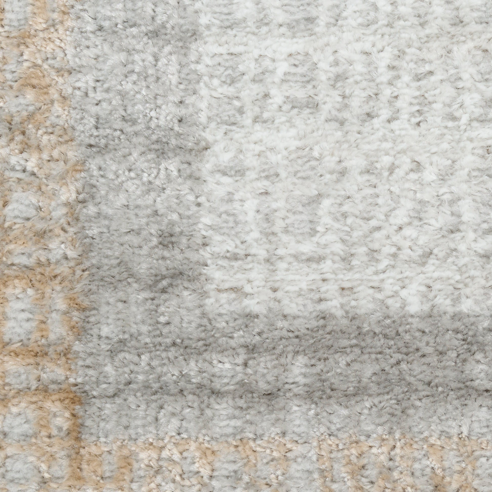 Soft shag rug in light gray, ivory & beige with subtle geometric border for modern living room decor.