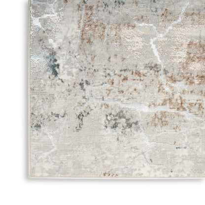 Soft distressed-area rug with abstract marbled pattern in ivory, gray, blue & bronze tones; low-pile.