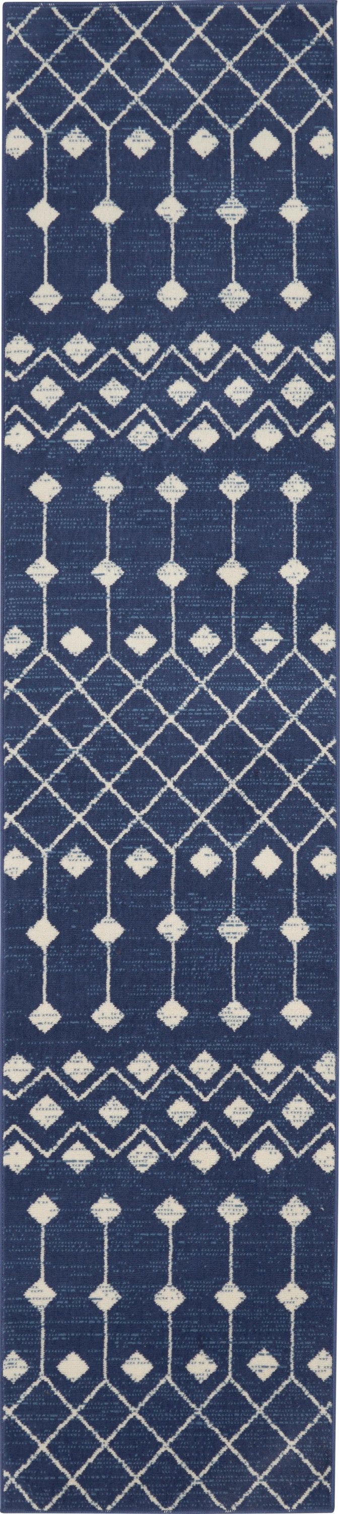 Navy blue woven rug runner with cream geometric lattice and diamond motifs in vertical bands.