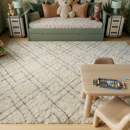 Nourison Dreamy Shag 9' x 12' ivory area rug from Primoends with ultra-plush shag pile, soft neutral color, modern indoor rug for living room or bedroom décor.