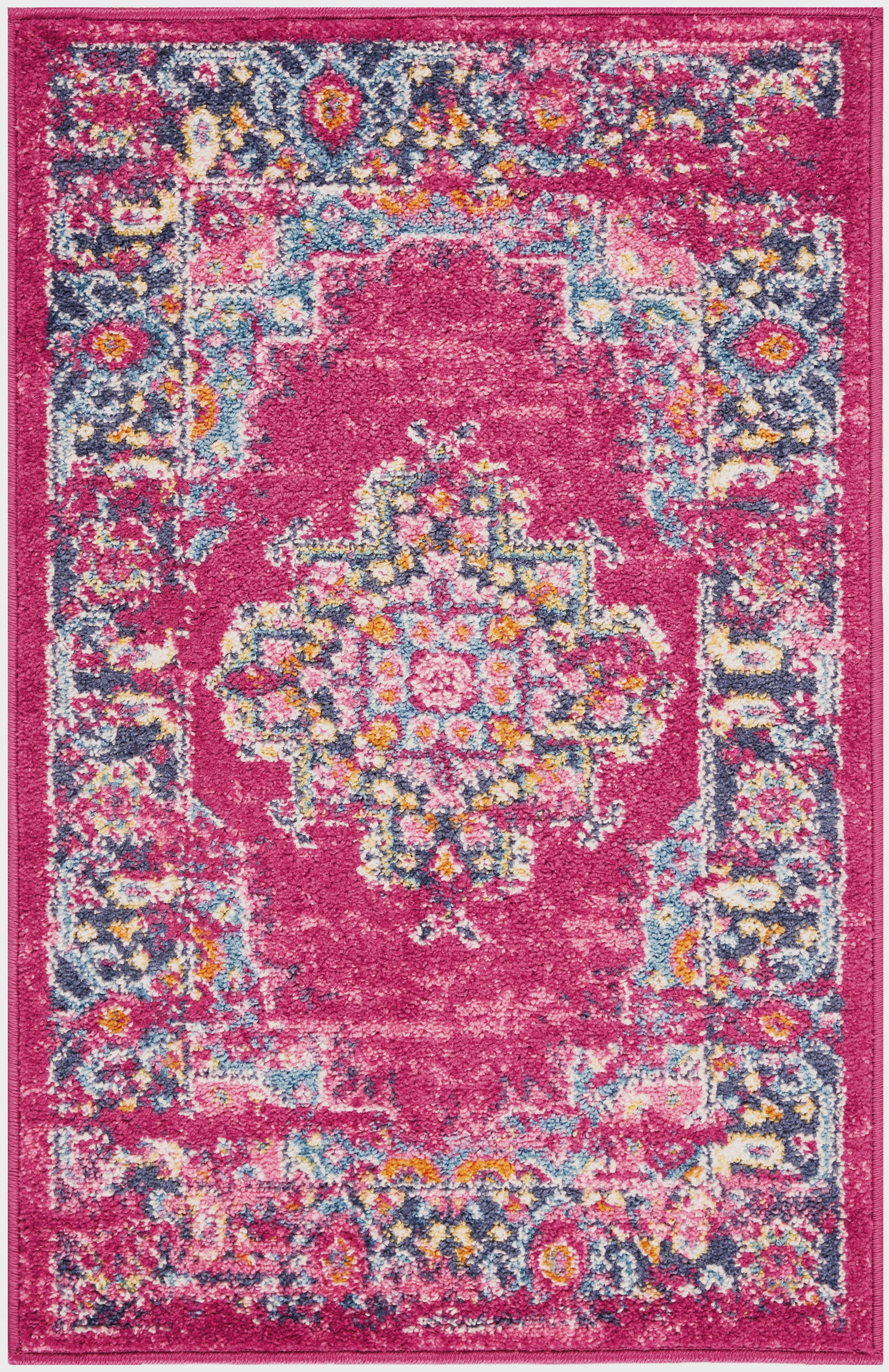 Vibrant pink patterned rug with central floral medallion, blue, yellow and white accents, decorative outer border.