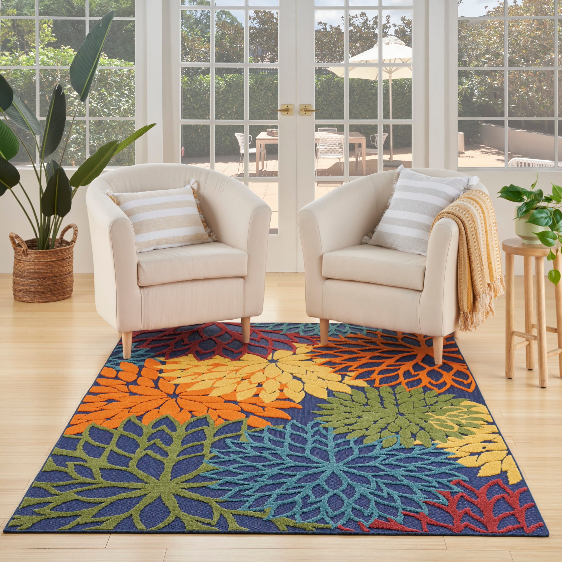 Outdoor rug with a bold multicolor leaf-pattern.
