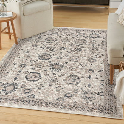 Cream area rug with gray-blue vintage medallion pattern and border, woven texture, perfect for living room.