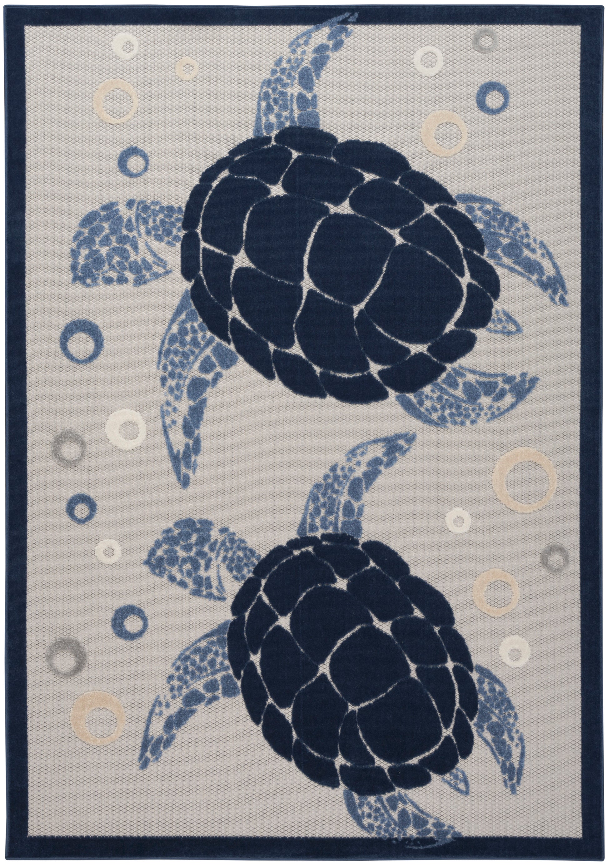 Coastal area rug featuring two navy sea turtles on beige, with blue bubble accents and a dark navy border.