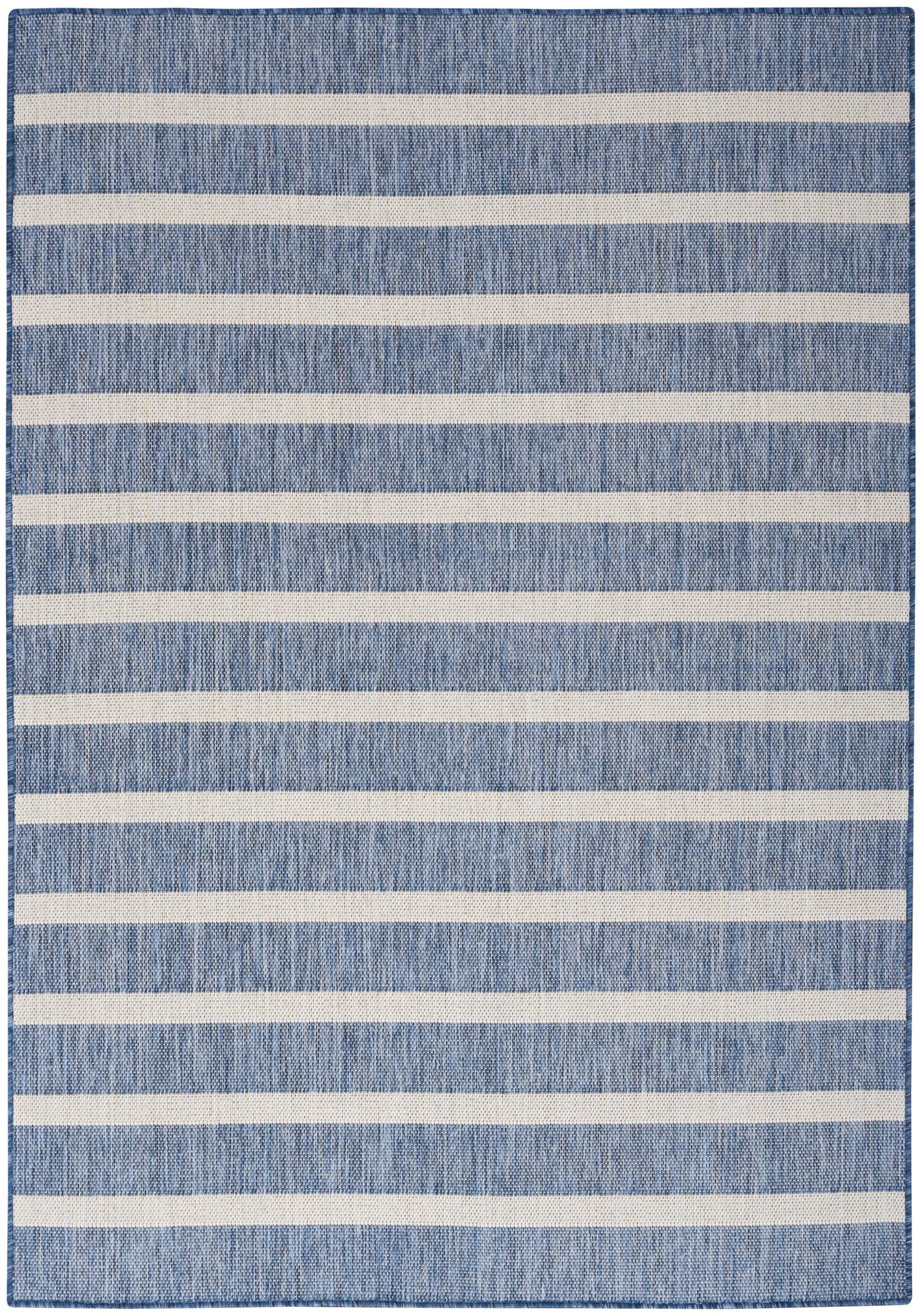 Denim-blue woven rug with bold off-white horizontal stripes, rectangular, casual coastal style.