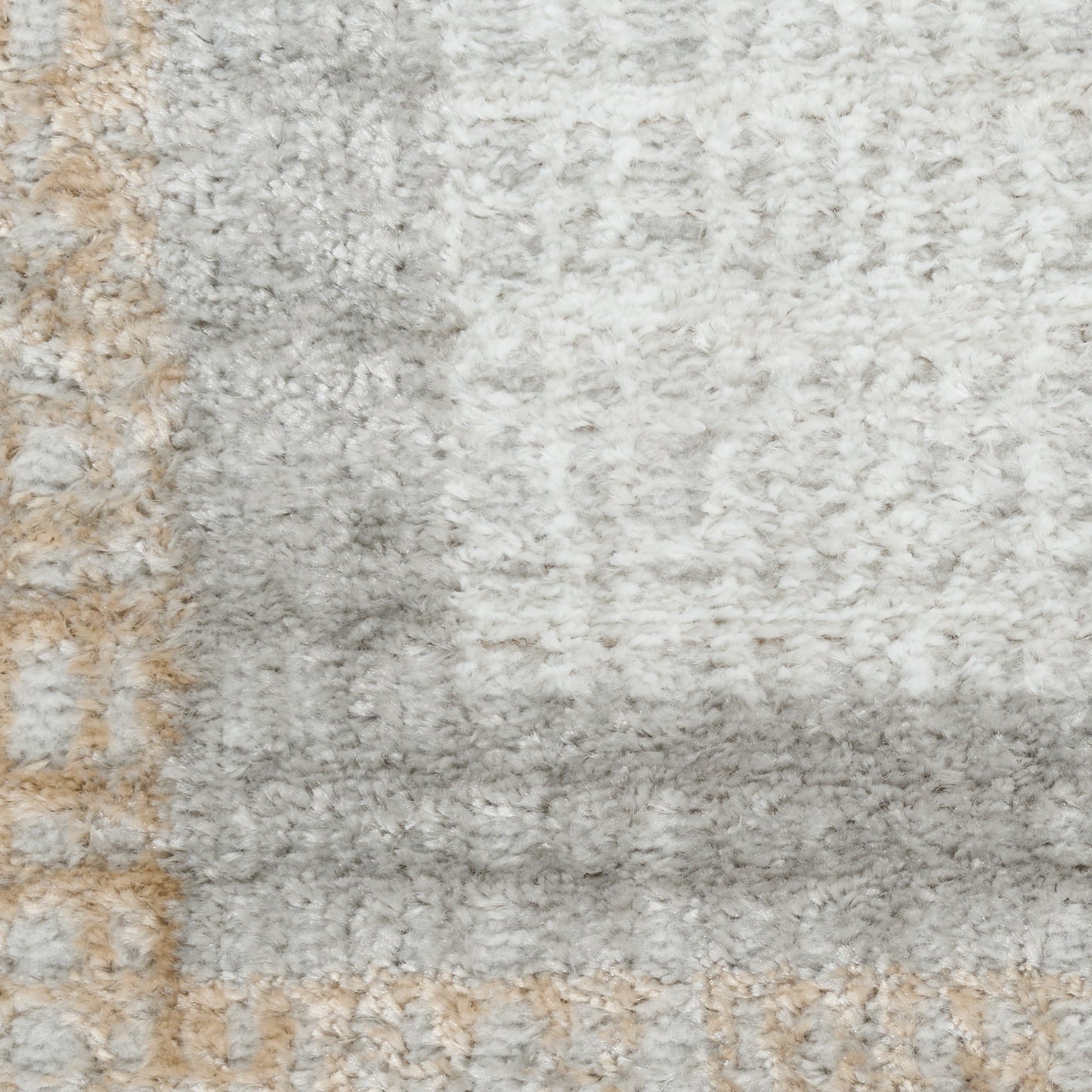 Light gray shag rug with beige border; plush, soft pile, rectangular living-room decor for a cozy look.