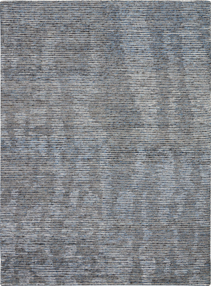 Rectangular blue-gray woven rug with subtle marbled abstract pattern and tonal stripes; modern living room decor.