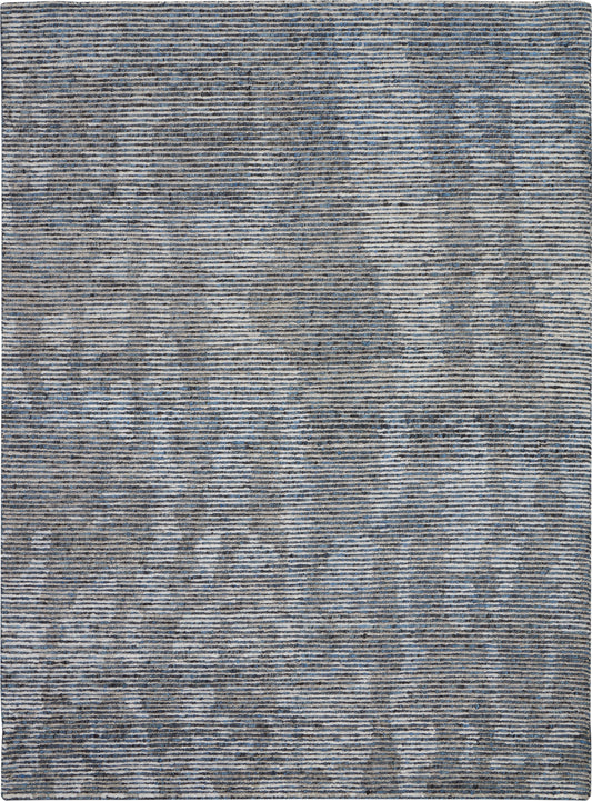 Rectangular blue-gray woven rug with subtle marbled abstract pattern and tonal stripes; modern living room decor.