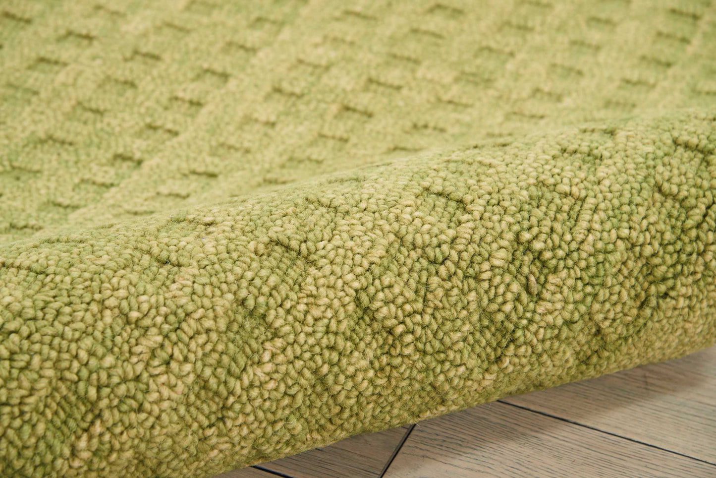 Olive green textured shag rug with dense loop pile, cozy home decor for living rooms.