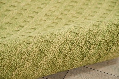 Olive green textured shag rug with dense loop pile, cozy home decor for living rooms.