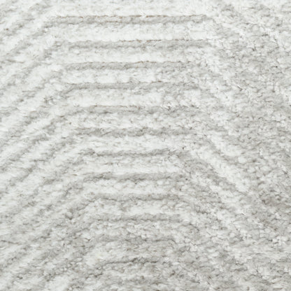 Light gray shag rug with plush pile and subtle chevron wave pattern