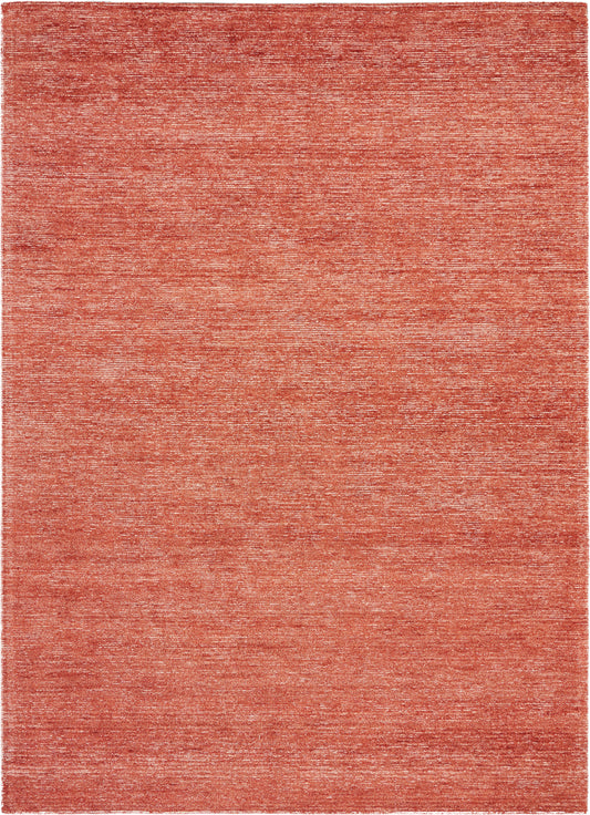 Rectangular coral-orange rug with a soft, heathered texture; modern, cozy home decor.