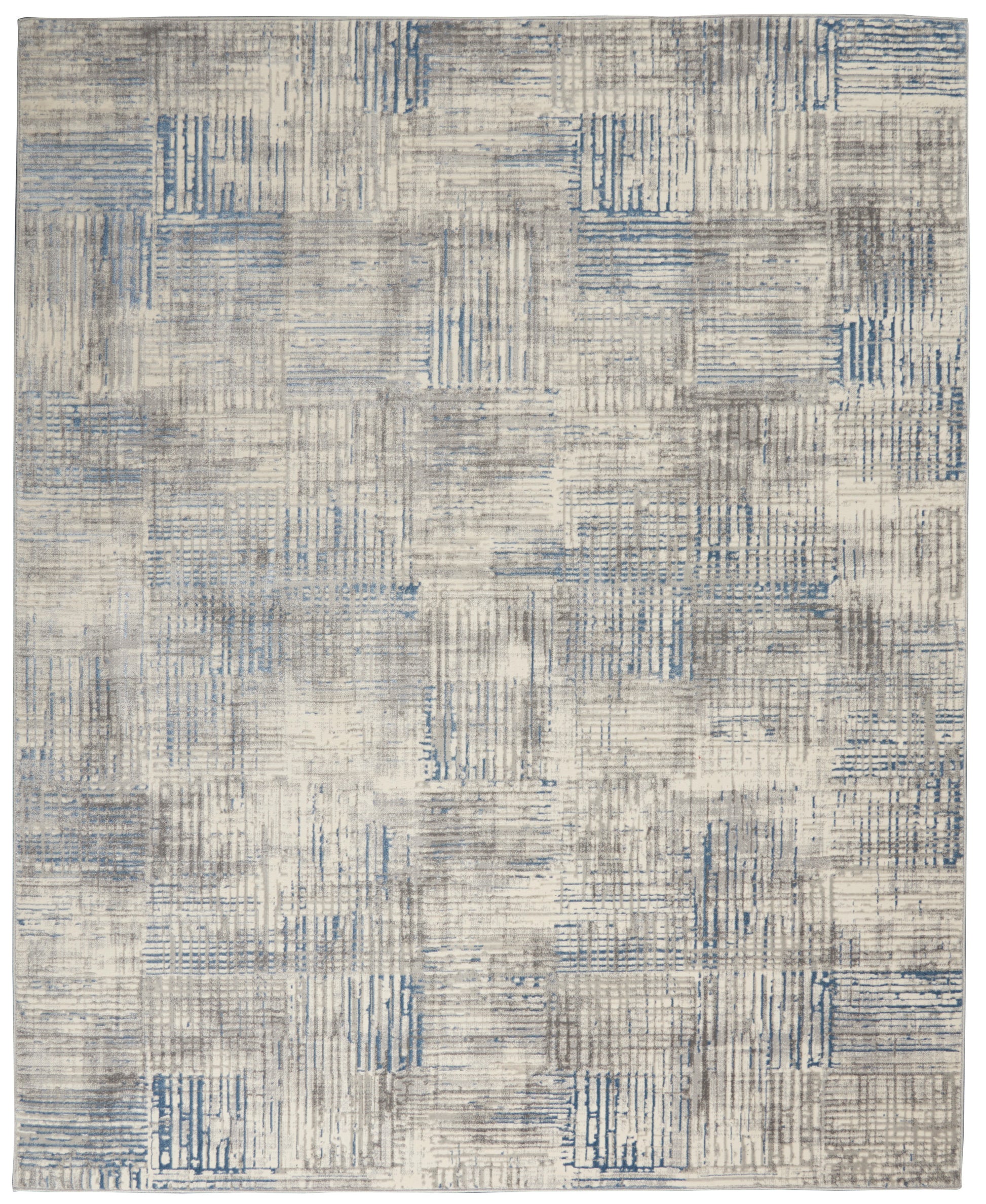 Blue-gray patchwork area rug with distressed linear block patterns in beige tones.