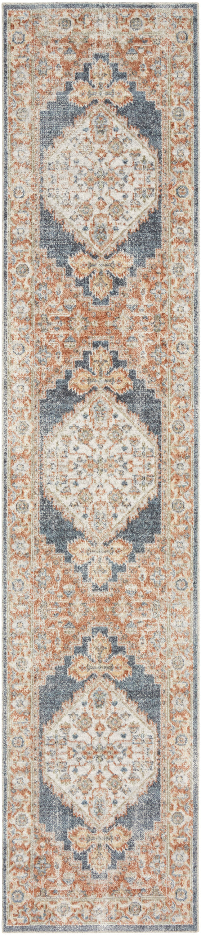Long oriental rug runner with repeating ivory medallions, peach and blue accents, intricate floral border.