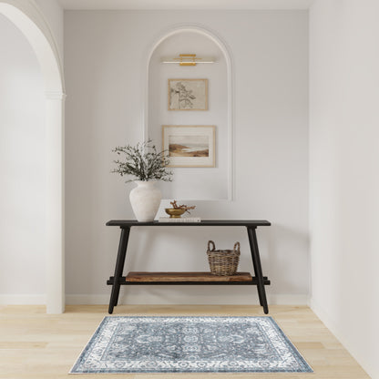 Black console with wood shelves in an arched wall niche; vase with branches, basket, framed art, and blue rug.