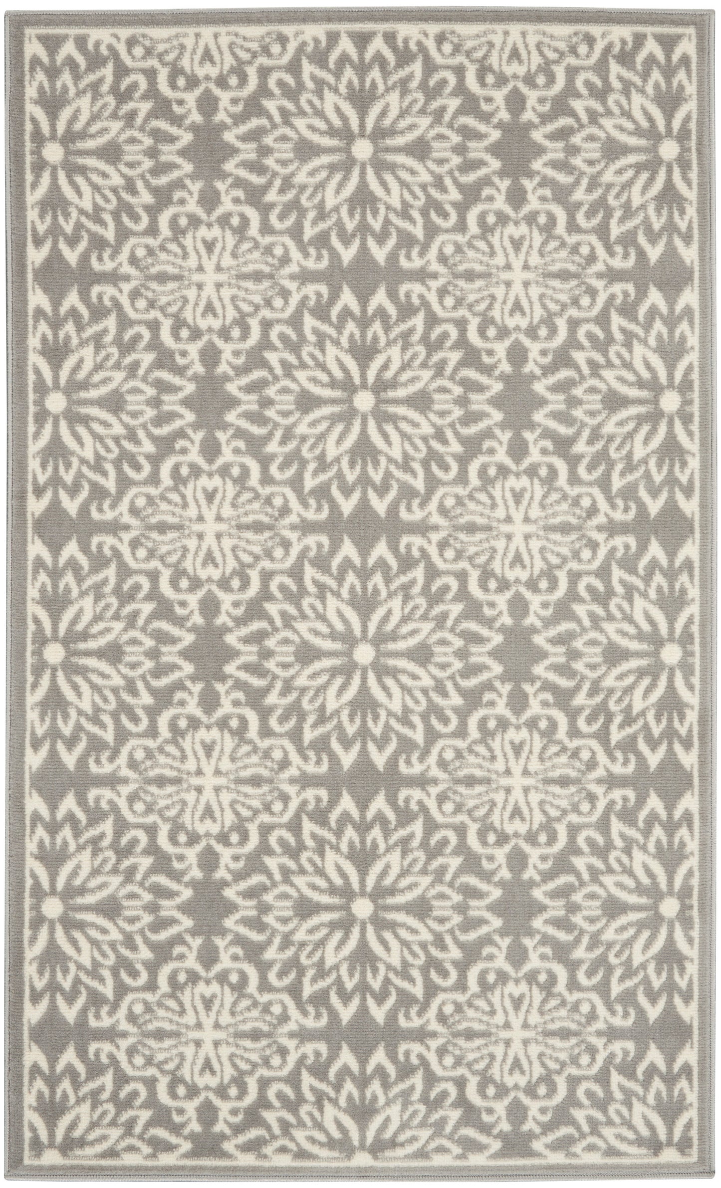 Gray rug with white damask floral pattern and a pale border, rectangular woven rug for living room.