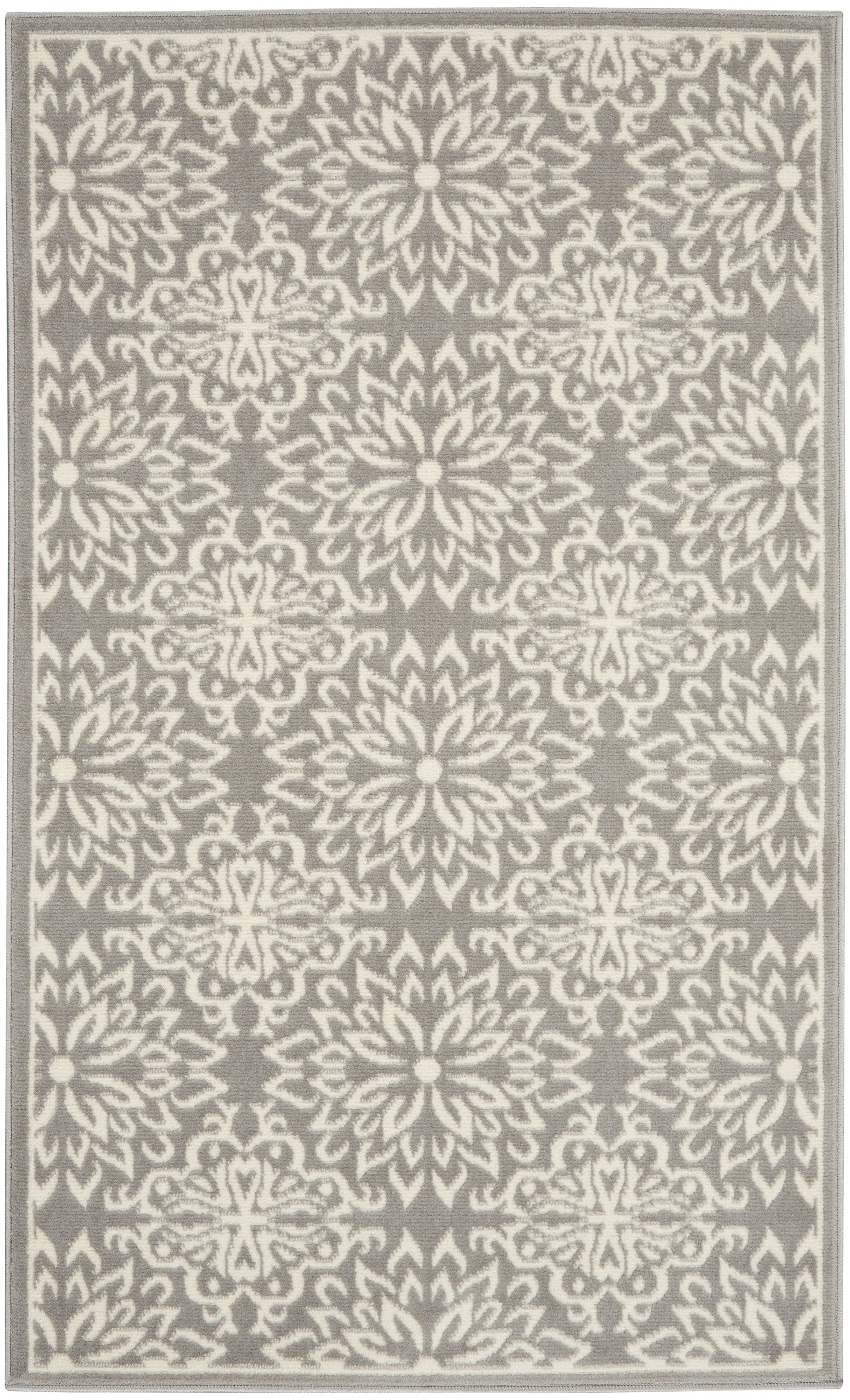 Gray rug with white damask floral pattern and a pale border, rectangular woven rug for living room.