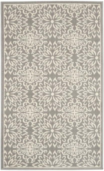 Gray rug with white damask floral pattern and a pale border, rectangular woven rug for living room.