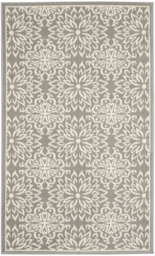 Gray rug with white damask floral pattern and a pale border, rectangular woven rug for living room.