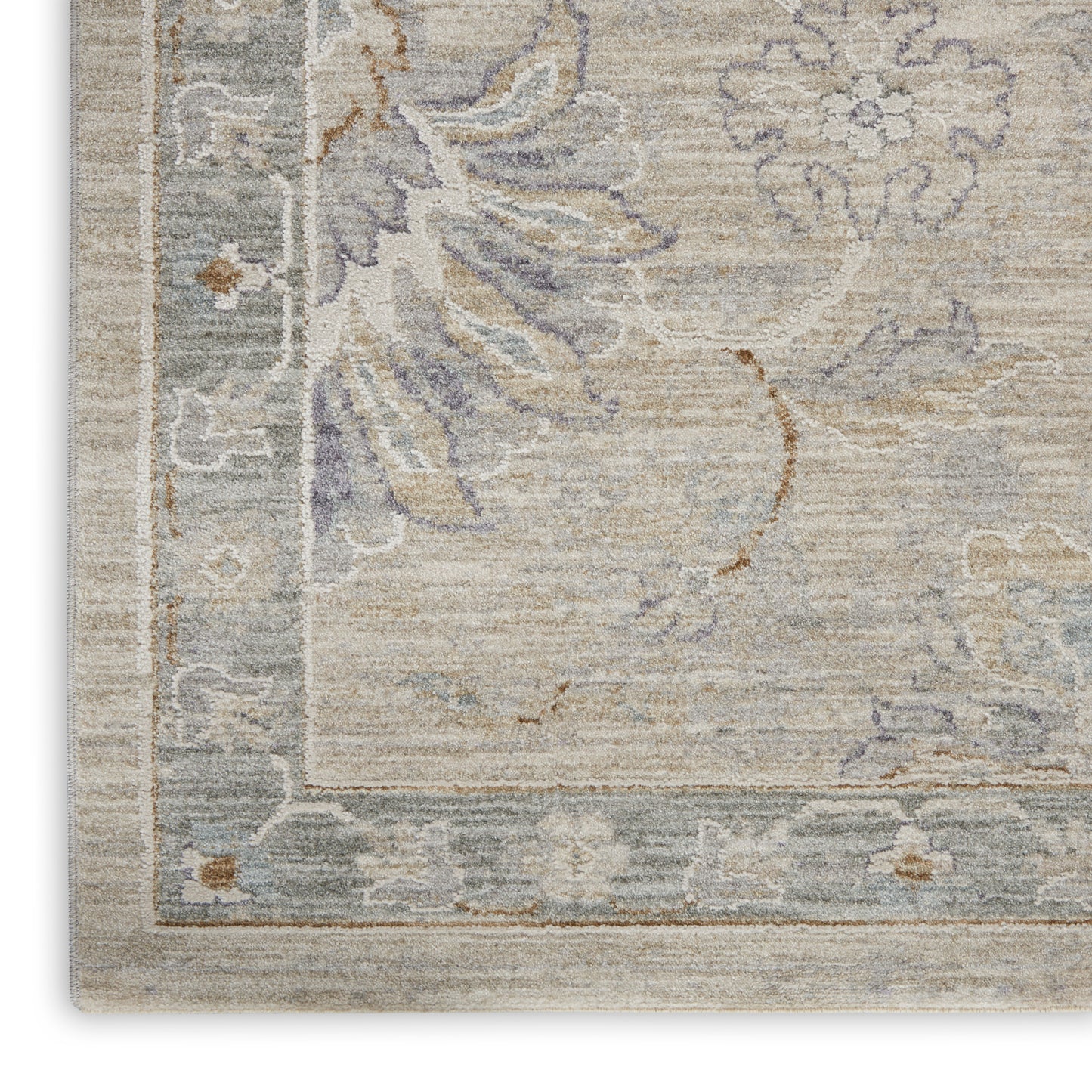 Rectangular beige floral area rug with muted blue-gray border and lavender accents.