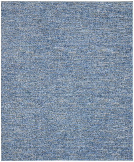 Blue heathered area rug with subtle variegated blues and soft woven texture, modern living room floor covering.