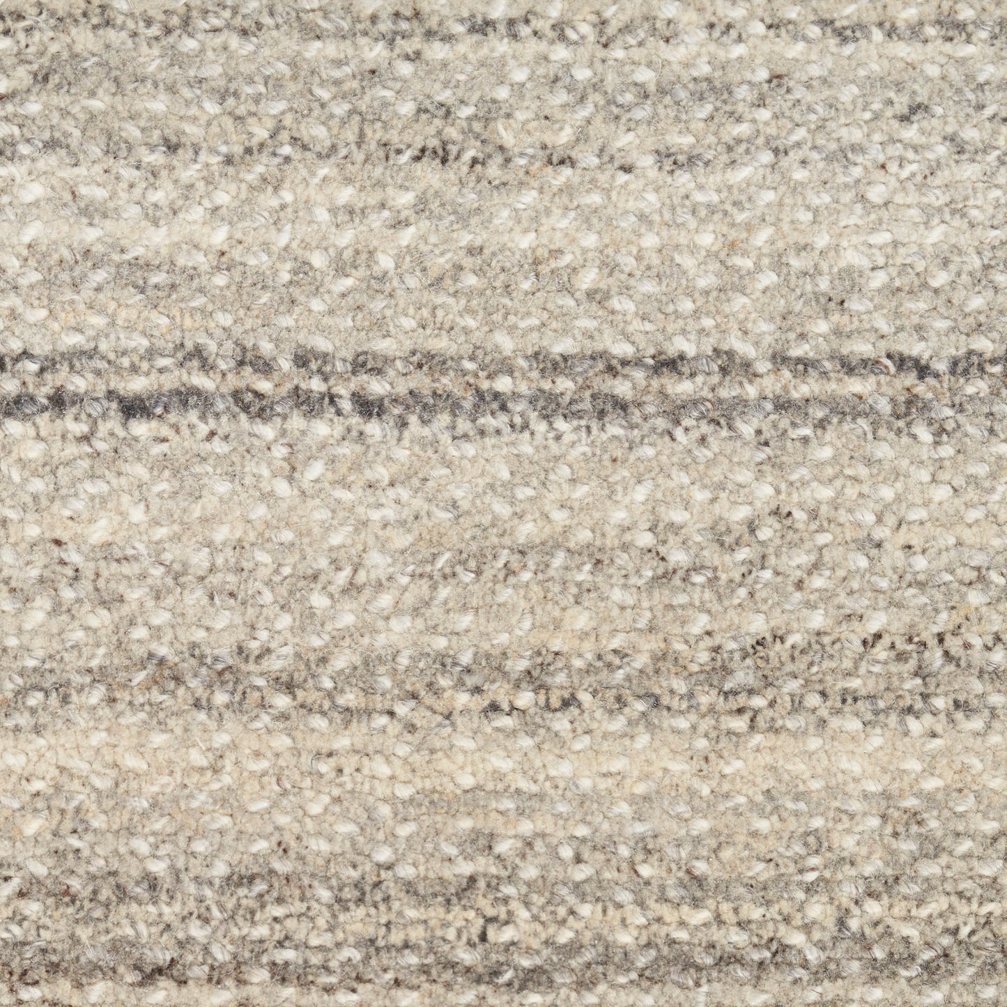 Beige and gray loop-pile carpet with subtle horizontal stripes and a textured surface.