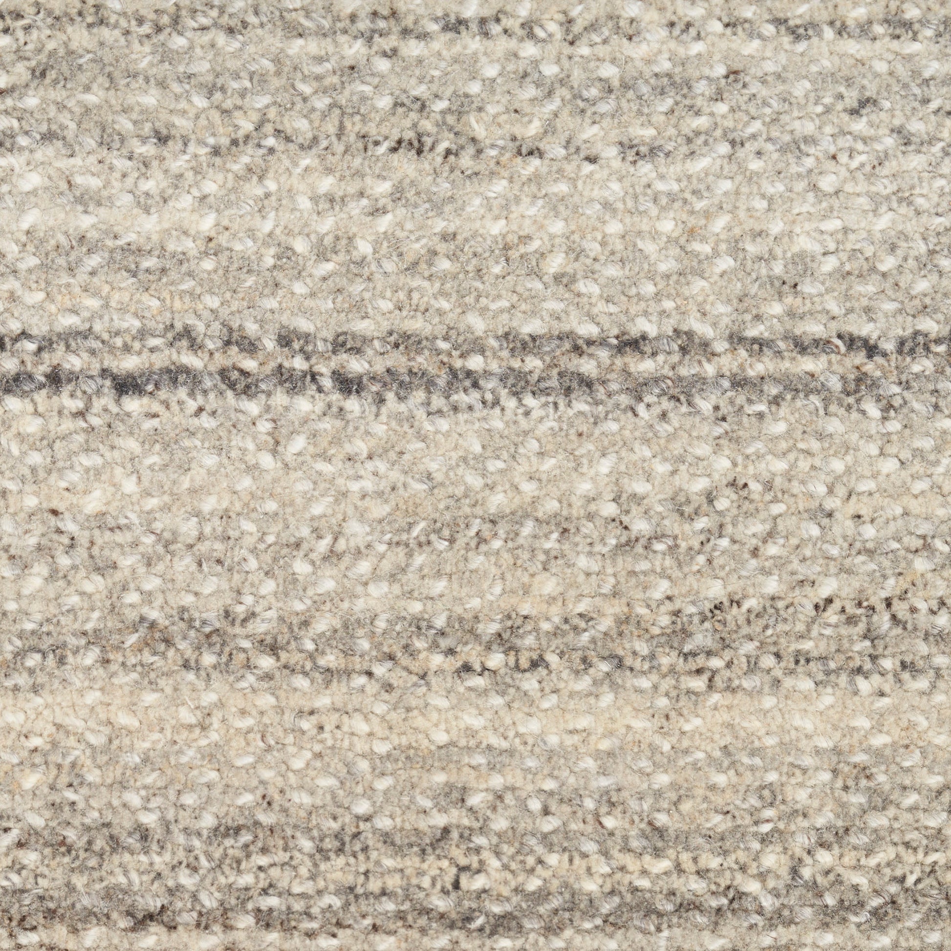 Beige and gray loop-pile carpet with subtle horizontal stripes and a textured surface.