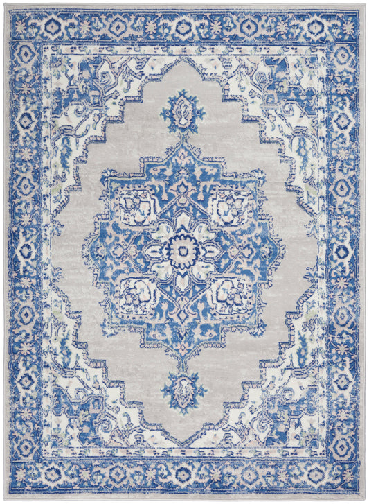 Blue and ivory oriental area rug with a central medallion, intricate floral motifs, and ornate border.