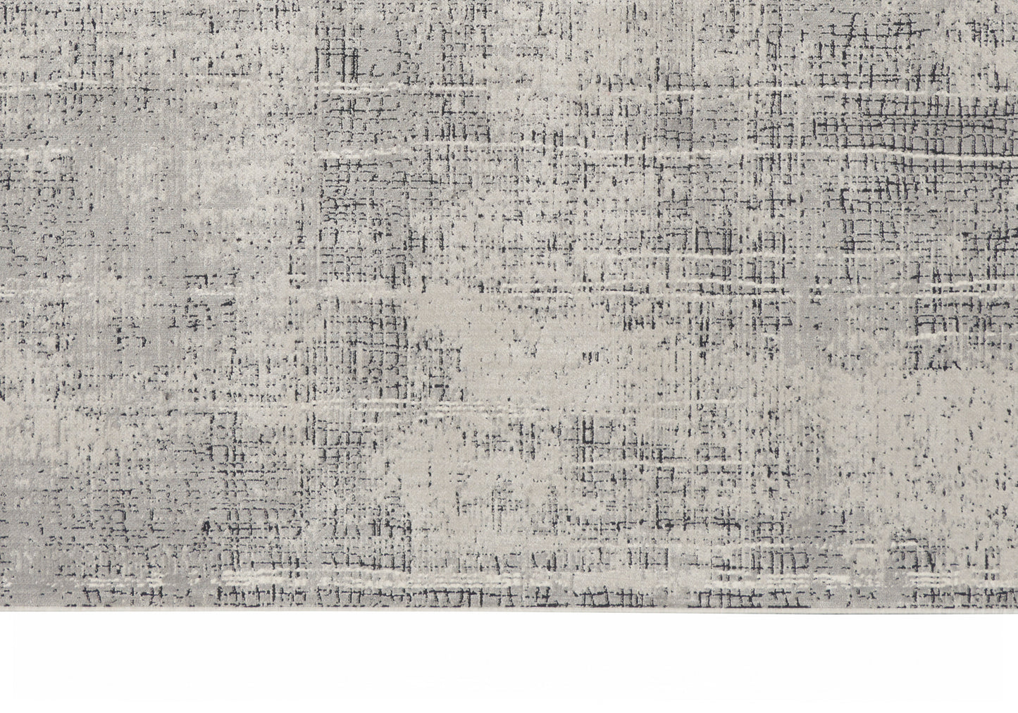 Light gray distressed area rug with abstract textural pattern; rectangular, modern home decor.