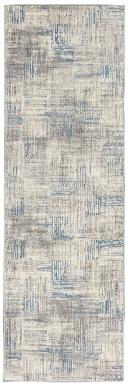 Rectangular abstract area rug in beige, gray and blue with a distressed patchwork pattern; modern living room decor.