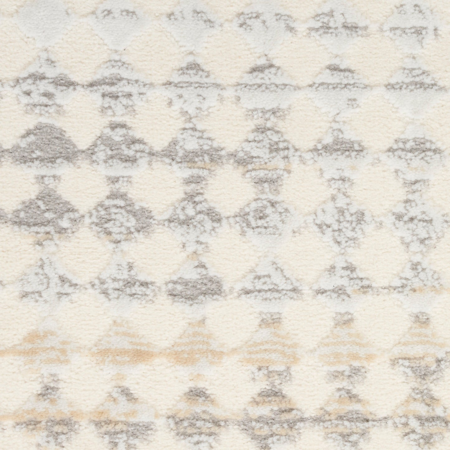 Ivory shag area rug with light gray diamond trellis pattern and soft beige accents; plush texture.
