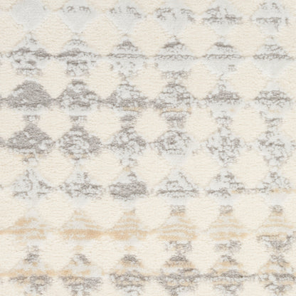 Ivory shag area rug with light gray diamond trellis pattern and soft beige accents; plush texture.