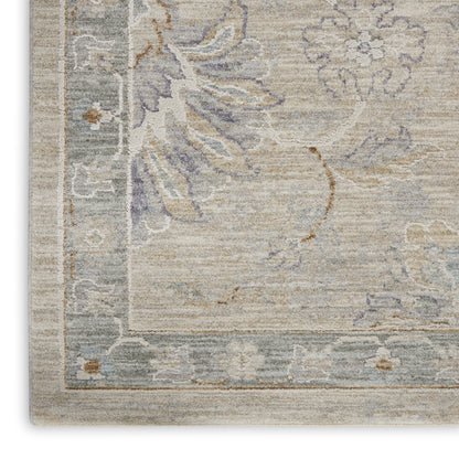 Vintage-style beige rug with soft blue-gray border and lavender floral motifs.