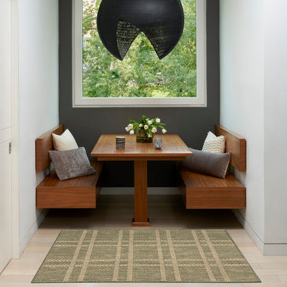 Wooden corner dining set with square table, benches, gray cushions, vase of flowers, black pendant lamp, window view.