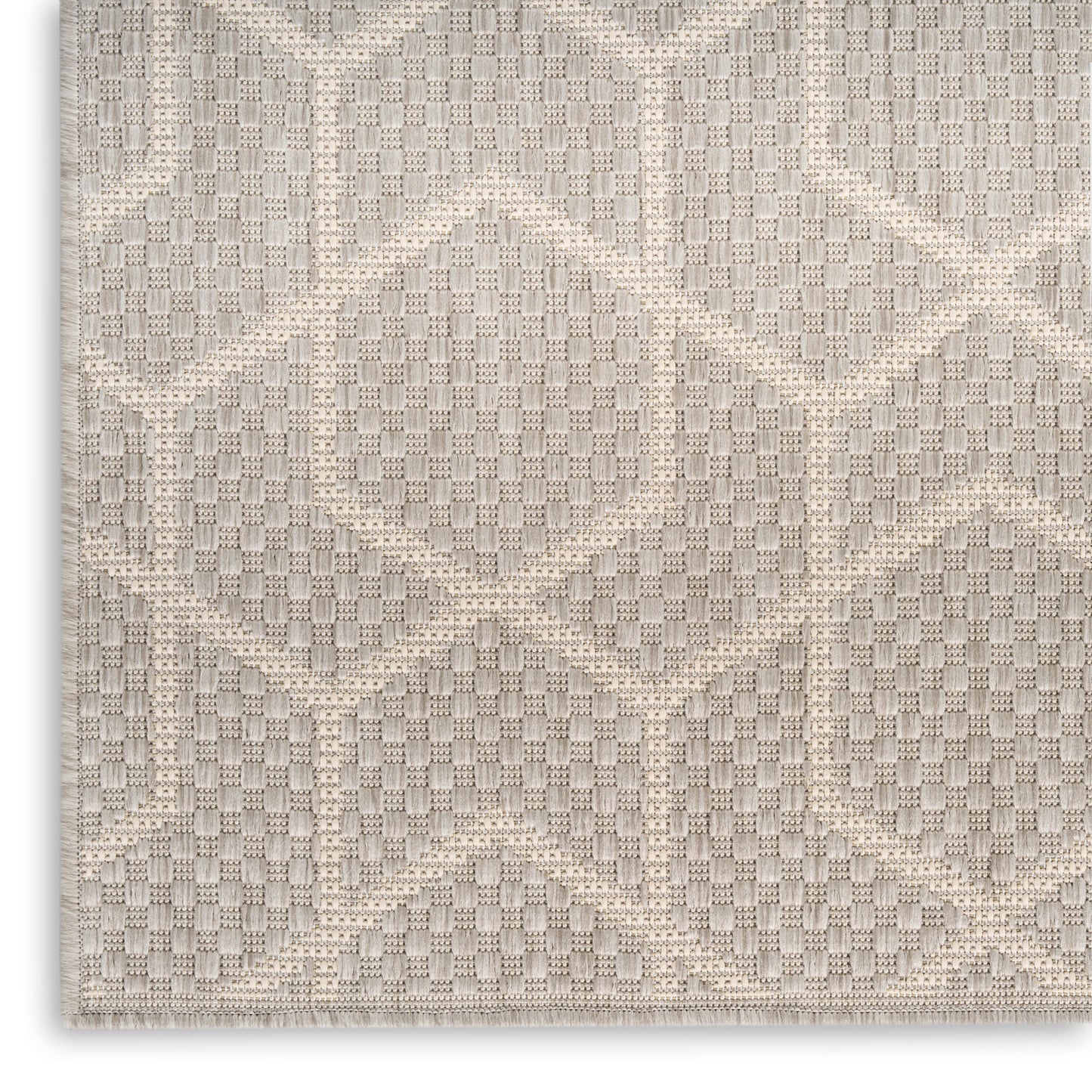 Cream beige geometric rug with raised diamond pattern and subtle woven grid texture.