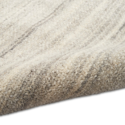 Beige high-pile shag rug with subtle taupe stripes and plush, textured surface.