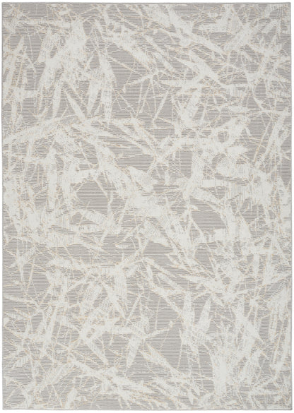 Rectangular rug with light gray base & cream abstract crackle pattern; modern woven area rug.