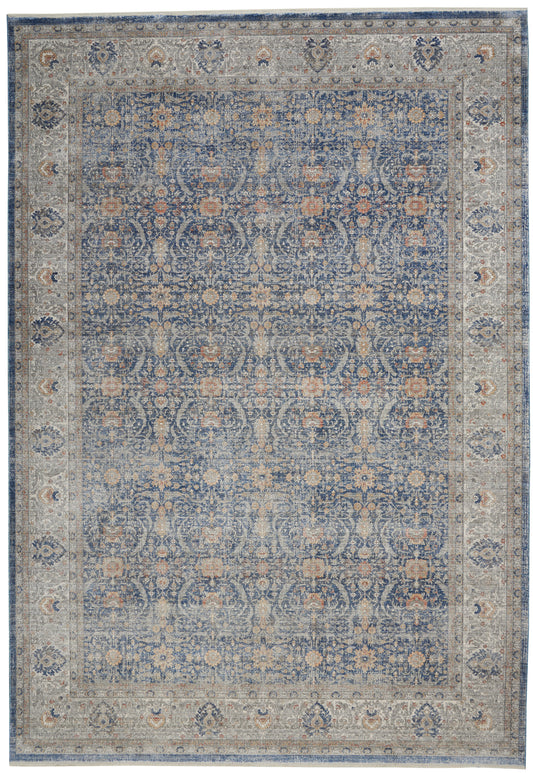 Blue-toned oriental rug with cream border and intricate floral scrollwork.