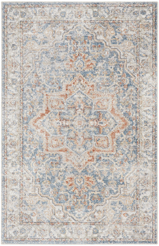 Distressed blue-gray oriental rug with soft orange accents, featuring an intricate central medallion and ornate border.